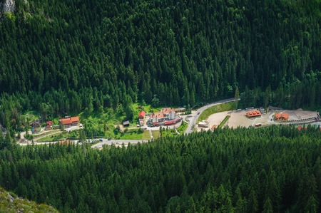 Bird view from Suhardul Mic mountain to populated valley in Red Lake AKA Lacu Rosu area, Carpathians Romania.の写真素材