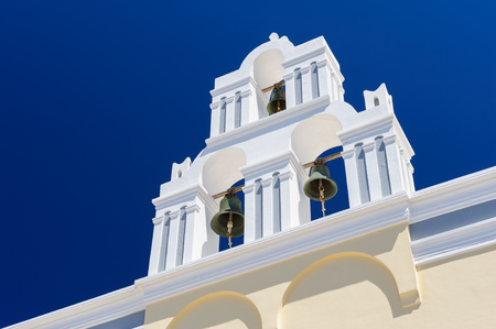 Blue and white orthodox church bell tower. Oia, Santorini Greece. Copyspaceの写真素材