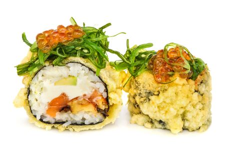 Tempura hot fried sushi maki with seabass, smoked eel, avocado and cream cheese, topped with chuka seaweed with red caviar, isolated on white backgroundの写真素材