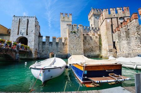 Sirmione, province of Brescia, Lombardy, northern Italy, 15th August 2016: people visiting the medieval castle Scaliger on lake Lago di Gardaのeditorial素材