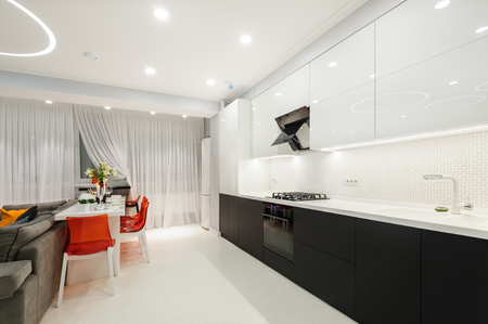 Modern white kitchen and dining roomの写真素材
