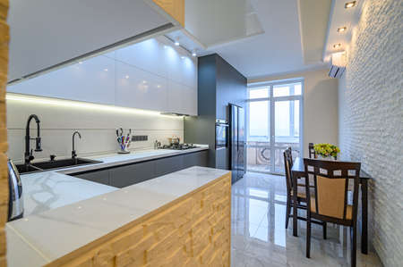 Luxury white and dark grey modern kitchen interiorの写真素材