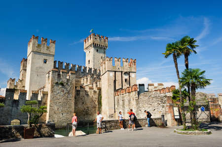 Medieval castle Scaliger in old town Sirmione on lake Lago di Garda, northern Italyのeditorial素材
