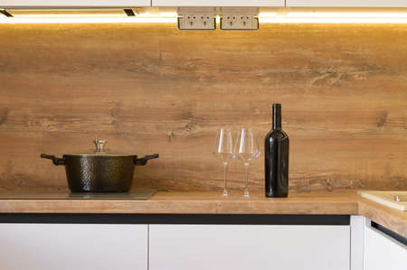 Modern white and beige wooden kitchen interior detailsの写真素材