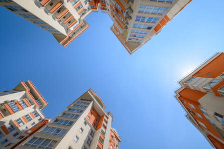 New modern apartment buildings shot from belowの素材 [FY310171757389]