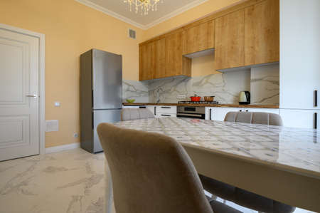 White and wooden modern kitchen and dining room interior