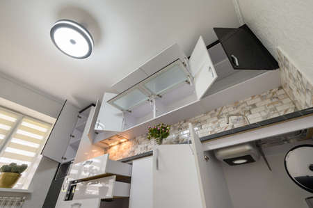 Renovated Interior for modern trendy white kitchen with doors open