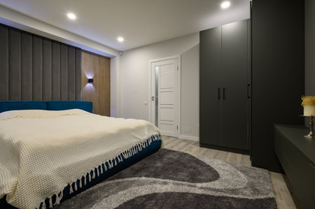 Modern master bedroom with trendy gray and white interiorの写真素材