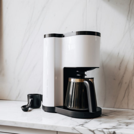 A black and white coffee maker sitting on top of a counter. AI generative image.の素材