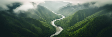 A river running through a lush green valley. AI generative image.の素材
