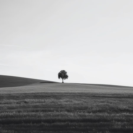 A lone tree stands alone in the middle of a field. Generative AI image.の素材