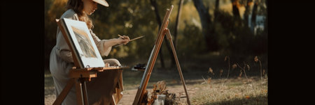 A woman in a hat painting on an easel. Generative AI image.の素材