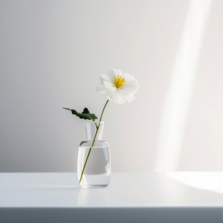 A single white flower in a glass vase. AI generative image.の素材