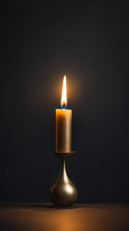 A lit candle sitting on top of a table. Generative AI image.の素材