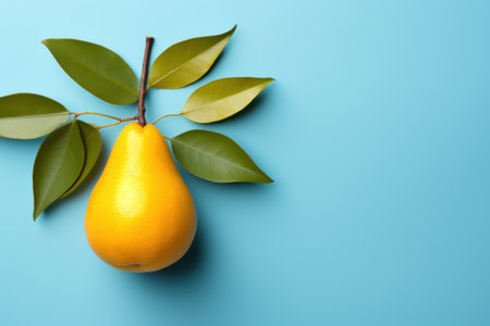 A pear with leaves on a blue background. Generative AI image.の素材