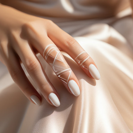 A womans hands with white manicured nails and a ring, AIの素材