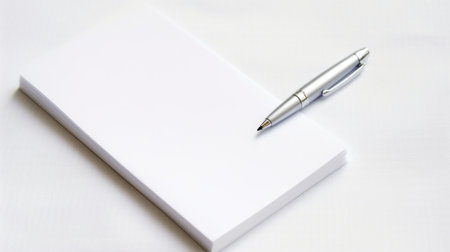 A white notepad with a pen on top, AIの素材