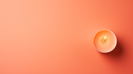 A single candle on a peach fuzz pink background with orange and peach fuzz , AIの素材