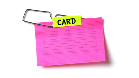 A pink sticky note with a yellow tag attached to it, AIの素材