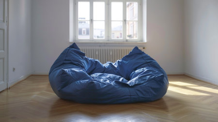 A bean bag chair sitting in front of a window on an empty floor, AIの素材