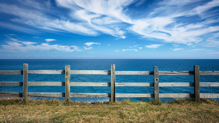 A wooden fence with a view of the ocean and sky, AIの素材