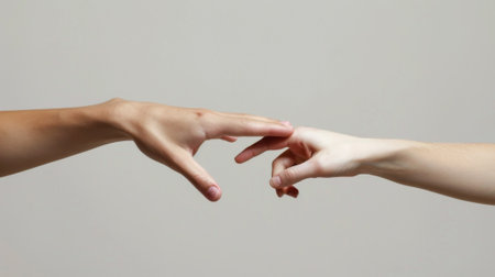 Two hands reaching for each other with a gray background, AIの素材