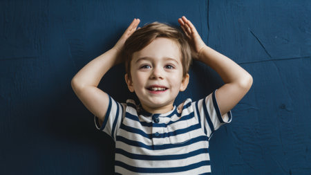 A young boy with his hands on top of head smiling, AIの素材