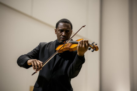A man in a black suit playing the violin while standing, AIの素材