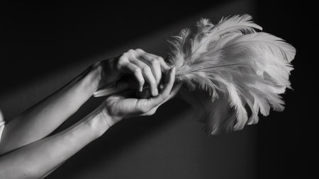 A person holding a feather in their hands with the other hand, AIの素材