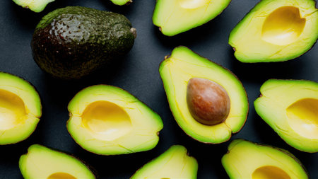 A bunch of avocados are cut into pieces and sitting on a table, AIの素材