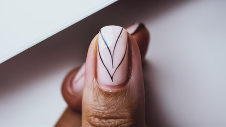 A womans hand with a pink and white manicure, AIの素材