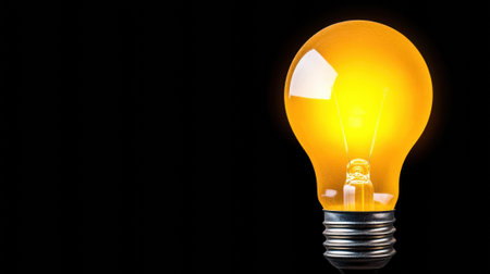 Bright light bulb glowing against a dark background, symbolizing innovation and ideas, AIの素材