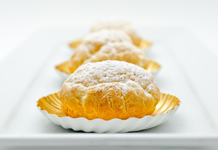 Eclair cakes on white plateの写真素材