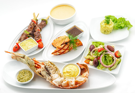 Set of international dishes arranged for catering, studio shotの写真素材