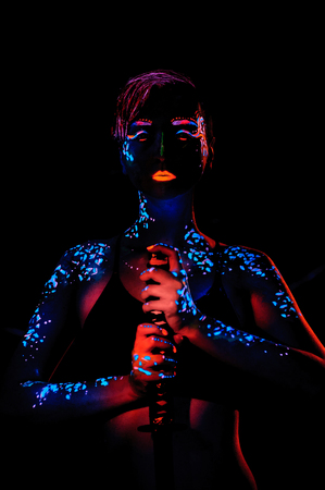 Girl with neon paint bodyart portrait, studio shotの写真素材