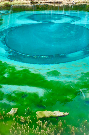 Geyser lake with clear cyan water in Altai mountainsの写真素材