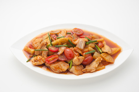 Fried chicken with cashew nuts isolated on whiteの写真素材