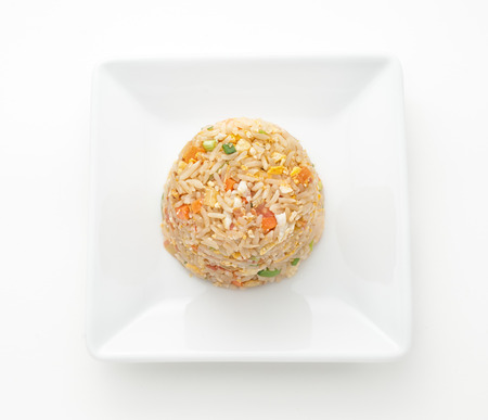 Fried rice with vegetables isolated on whiteの写真素材
