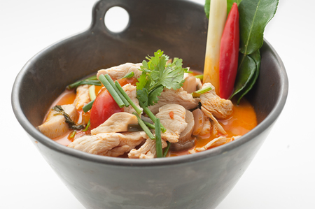 A bowl of Thai traditional soup "Tom Yam" isolated on whiteの写真素材