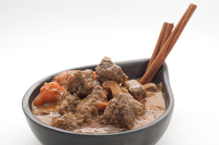 Massaman soup with beef isolated on whiteの写真素材