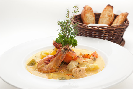 Curry soup with shrimps isolated on whiteの写真素材