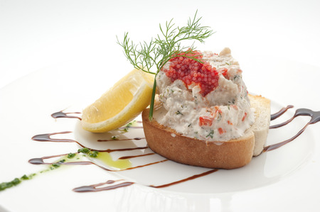 Sandwich with tuna salad and red caviar isolated on whiteの写真素材