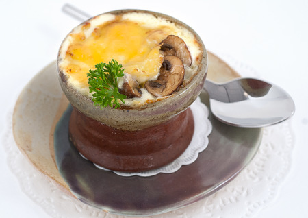 Stew with mushrooms in a small bowl isolated on whiteの写真素材
