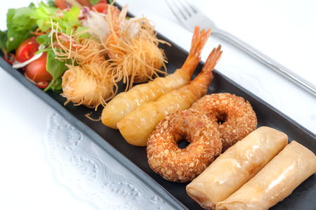 Mixed Thai traditional appetizers isolated on whiteの写真素材