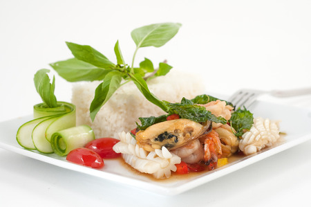 Mixed seafood, mussel and squid, with steamed rice isolated on whiteの写真素材