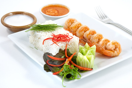 Grilled prawns with steamed rice isolated on whiteの写真素材