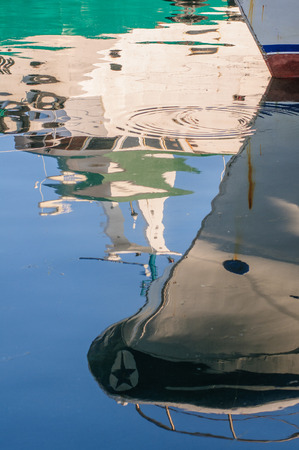 Fisherman boats moored along channel in Chioggiaの写真素材