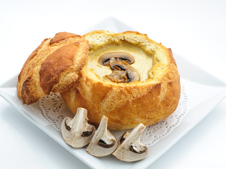Cheese cream soup served in a loaf studio shotの写真素材