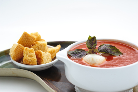 Tomatoe soup with mozarella cheese studio shotの写真素材