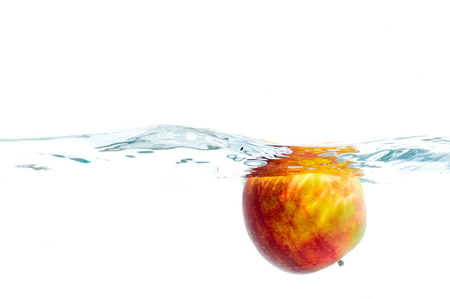 Fresh fruits immerced in clear water, studio shotの写真素材